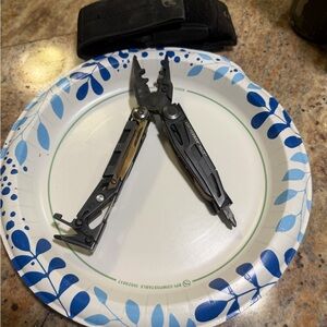 Black leatherman MUT Multi-Tool with nylon hook and loop Molle Pouch